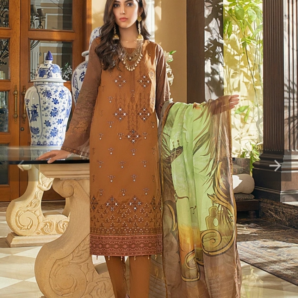 Salitex embroidered mirror work embossed lawn festive suits.